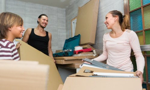 Customer placing items into a secure storage unit at Welling Storage
