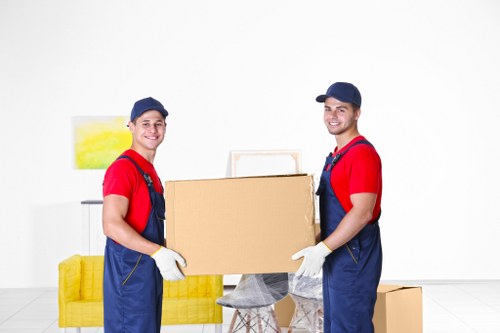 Professional movers loading furniture for a Welling relocation