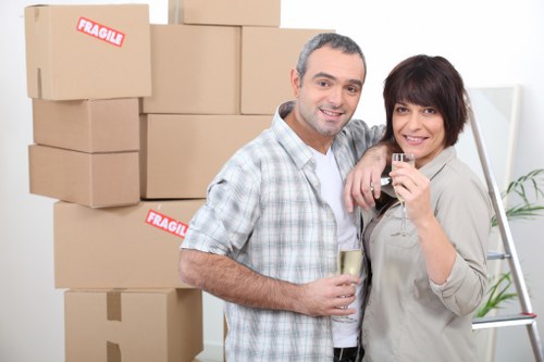 Stacked boxes and labelled belongings in a storage unit