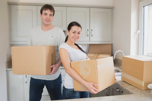 Packed boxes and furniture prepared for short-term storage in Welling